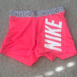 HOTPINK NIKE PROS. Lightly worn. Good conditions Sixe SMALL